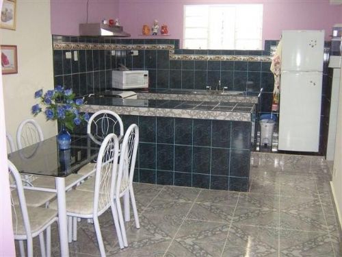 'Kitchen and Dining room' is what you can see in this casa particular picture. Casas particulares are an alternative to hotels in Cuba. Check our website cuba-particular.com often for new casas.
