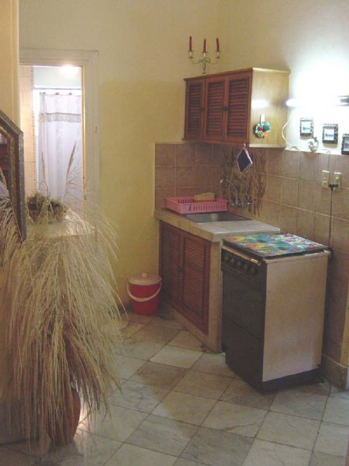 'Kitchenette and you can also view the bathroom door' is what you can see in this casa particular picture. Casas particulares are an alternative to hotels in Cuba. Check our website cuba-particular.com often for new casas.