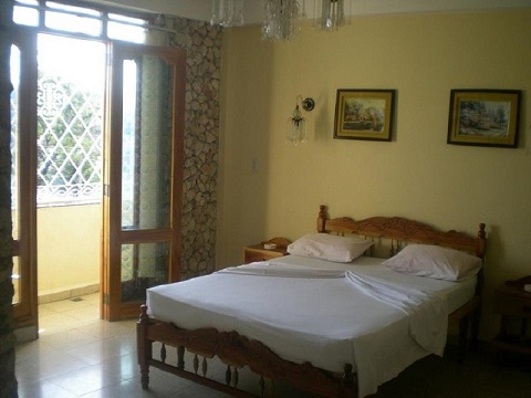'Bedroom 1 (with balcony)' is what you can see in this casa particular picture. Casas particulares are an alternative to hotels in Cuba. Check our website cuba-particular.com often for new casas.